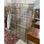 A vintage French wrought iron wine cage, width 102cm, depth 56cm, height 164cm
