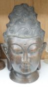 A Chinese bronze head of Buddha, 34cm