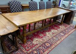 A large 18th century style rectangular oak refectory dining table, length 296cm, depth 89cm,