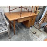 A mid century teak kneehole desk, length 121cm, depth 60cm, height 76cm