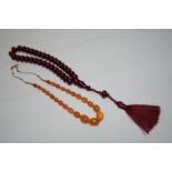 A Chinese amber and cherry amber type necklace