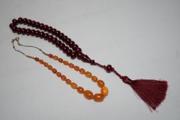 A Chinese amber and cherry amber type necklace