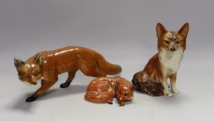 Two Beswick foxes and another