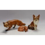 Two Beswick foxes and another