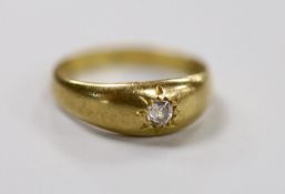 An 18ct gold and gypsy set solitaire diamond ring, size O/P, gross weight 3.9 grams.