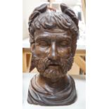 A carved walnut bust of a Roman emperor, 36cm