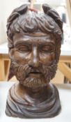 A carved walnut bust of a Roman emperor, 36cm