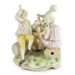 A Frankenthal porcelain group of three carousing men, c.1770-75, modelled by Karl Gottlieb Lück, one