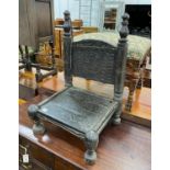 An Indian chip carved hardwood low seat chair, width 46cm, depth 43cm, height 71cm