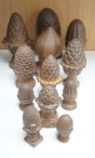 A group of cast iron finials, some with pine-cone decoration, tallest 21cm