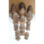 A group of cast iron finials, some with pine-cone decoration, tallest 21cm