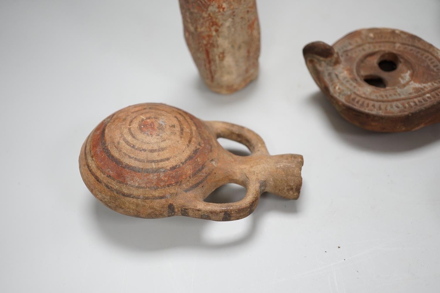 An Apulian black painted kylix, c. 4th century BCE., a Cypriot pottery flask, early Iron Age, two - Image 2 of 8