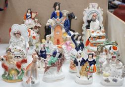 A collection of Victorian Staffordshire pottery flat-back figures and groups, tallest 29cm
