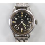 A gentleman's late 1940's steel military issue International Watch Co. manual wind black dial