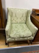 A small Edwardian mahogany upholstered wing armchair, covered in a pale green damask material, width