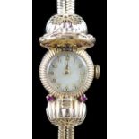 A lady's 1950's 9ct gold, ruby and diamond set manual wind cocktail watch, on a 9ct gold twin strand
