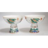 A pair of 19th century Chinese stem cups with four flower design, 9cm