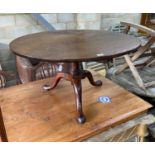 A George III circular mahogany tripod tea table, cut down, diameter 92cm, height 52cm