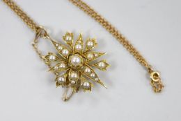 An Edwardian yellow metal and split pearl cluster set starburst pendant brooch, 37mm, on a later 9ct