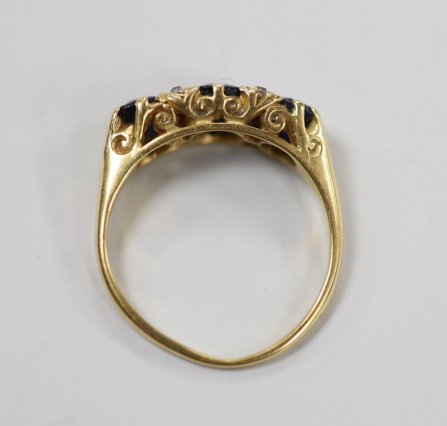 An early to mid 20th century gold, three stone sapphire and four stone diamond chip set half hoop - Image 4 of 4