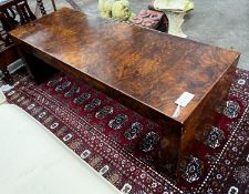 A contemporary rectangular walnut coffee table, length 122cm, depth 46cm, height 41cm