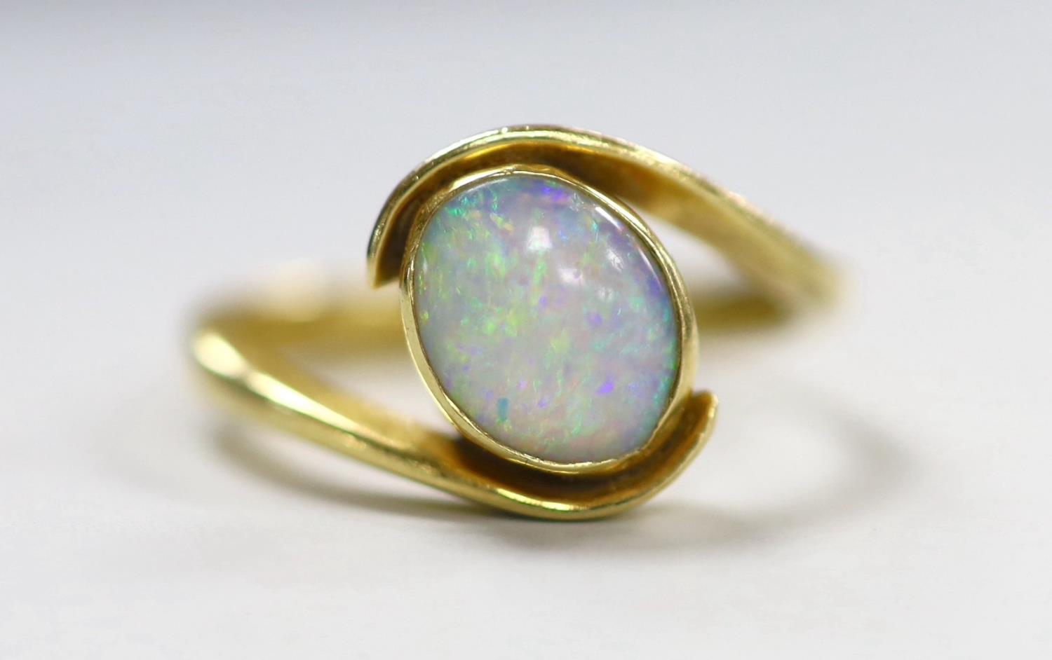 An 18ct and single stone oval white opal set ring, with crossover shoulders, size Q, gross weight - Image 2 of 4
