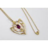 An Edwardian 9ct, garnet and seed pearl cluster set pendant, 33mm, on a later 9ct chain, 39cm, gross