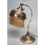 An adjustable Arts and Crafts brass and ‘jewelled’ table lamp, 34cm