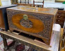 A carved Chinese camphor wood coffer, length 104cm, depth 52cm, height 63cm