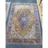 A Tabriz ivory ground carpet 360cm x 220cm