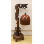 A Chinese carved hongmu 'dragon' stand with Japanese bell, 73cm tall