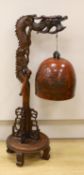 A Chinese carved hongmu 'dragon' stand with Japanese bell, 73cm tall