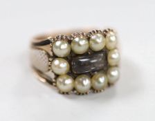 A 19th century yellow metal, plaited hair, enamel and split pearl set mourning ring, size P, gross