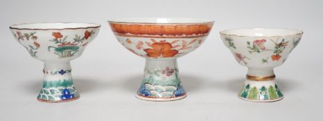 Three 19th century Chinese stem cups, painted with insects, flowers, bats and peaches, largest 9cm