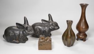 A pair of Chinese bronze models of rabbits, together with two vases and a dragon seal. Tallest 16cm