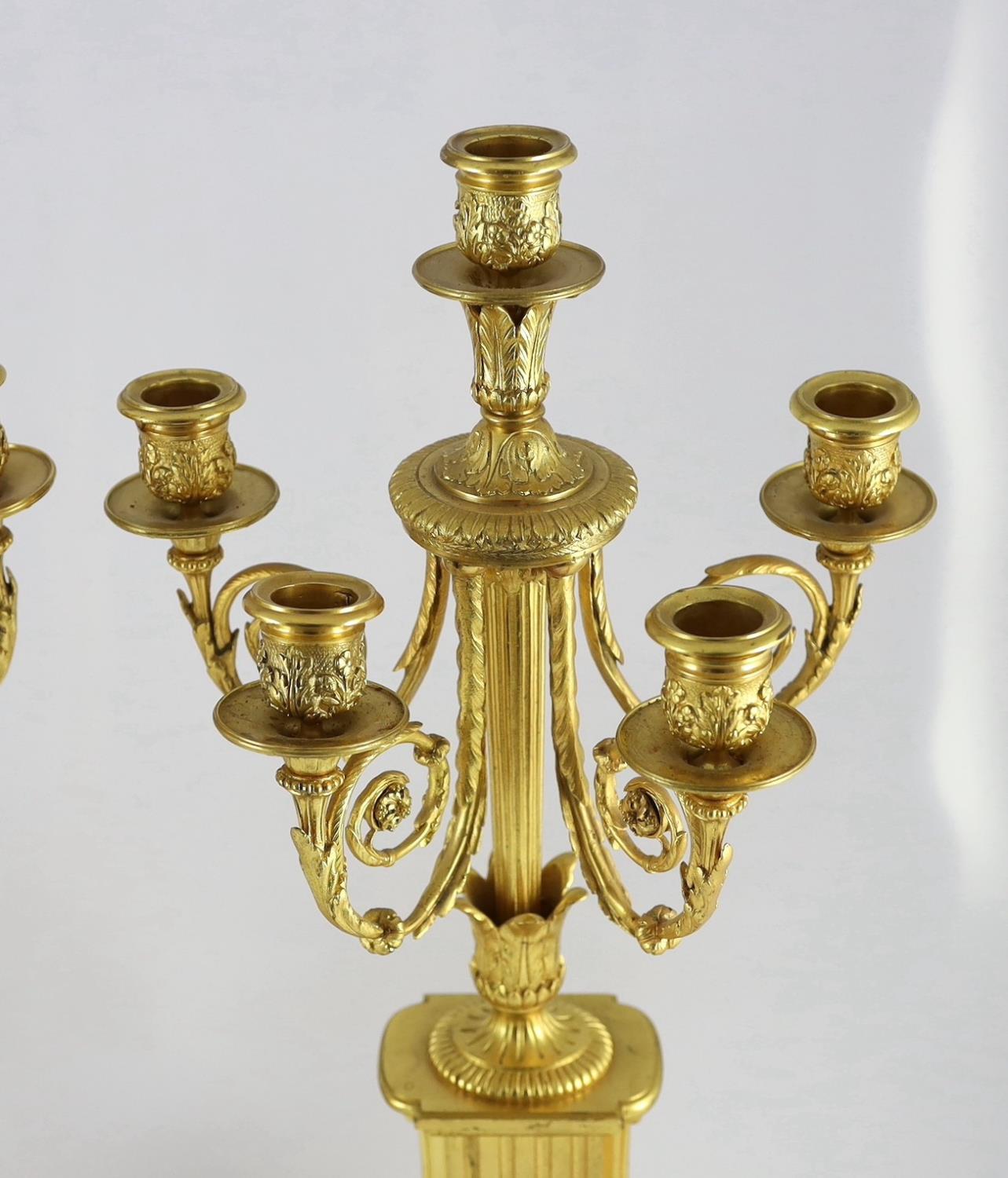 A pair of 19th century French ormolu five light candelabra, with foliate scroll branches and stepped - Image 3 of 6