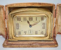 A cased Art Deco brass travelling timepiece
