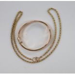 A modern 9ct gold ropetwist chain, 52cm and a 9ct gold hinged bangle, 19.7 grams.