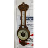 A Victorian oak cased aneroid wheel barometer and thermometer, height 82cm
