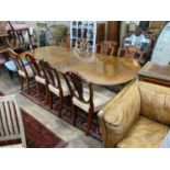 A William Tillman reproduction mahogany twin pedestal extending dining table, length 244cm extended,