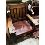 An early 20th century Stickley oak rocking chair, width 66cm, depth 50cm, height 86cm