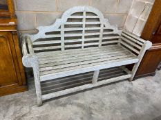 A Lutyens style teak garden bench, length 165cm, depth 64cm, height 101cm