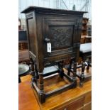 A small 17th century style carved oak side cabinet, width 53cm, depth 34cm, height 83cm