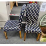 A set of eight reproduction upholstered dining chairs