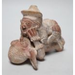 A Mayan or later biscuit earthenware erotic novelty whistle, 12cm long