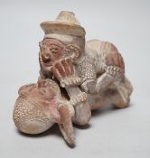 A Mayan or later biscuit earthenware erotic novelty whistle, 12cm long