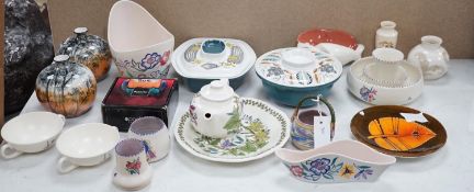 A collection of Poole pottery teapots, plates etc.