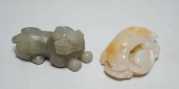 A Chinese white and russet Jade chilong carving and a celadon jade figure of a lion-dog, 7cm