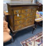 A George III walnut chest on later stand, width 109cm, depth 53cm, height 145cm