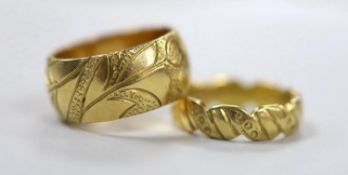 Two engraved 18ct gold wedding bands, sizes K and L/M, 15.7 grams.
